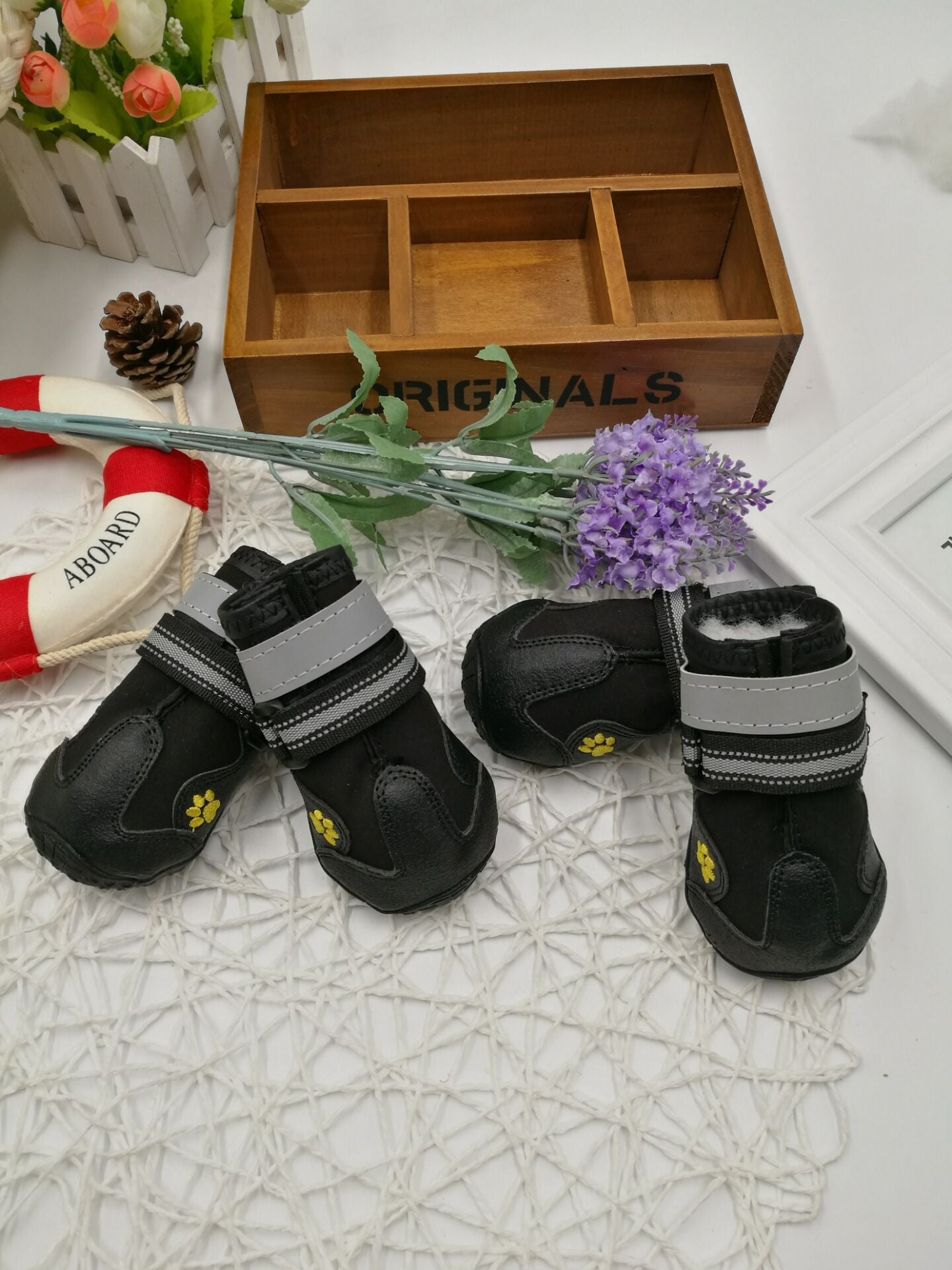 PawTrek™ Everyday Dog Shoes Features: 1. Waterproof PVC sole helps keep your feet dry, so dogs can wear them on light snow or muddy and wet streets. 2. The non-slip sturdy sole provides a protective layer to withstand hot and cold surfaces such as ice and