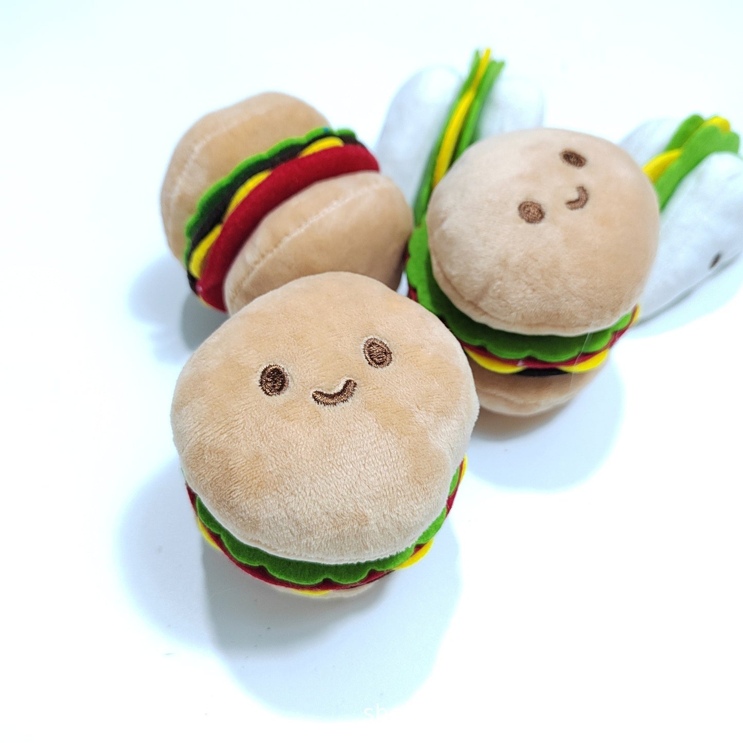 Squeaky Hamburger Toy – Fun Stress Relief for Pets Product information: Color: Hamburger, sandwich, rice ball Material: Plush Category: Pet Toys Product Name: Pet sounding toy Product size: 7*7 * 8CM (hamburger). 10*6 * 5C M (rice balls)7*7 * 7C M (sandwi